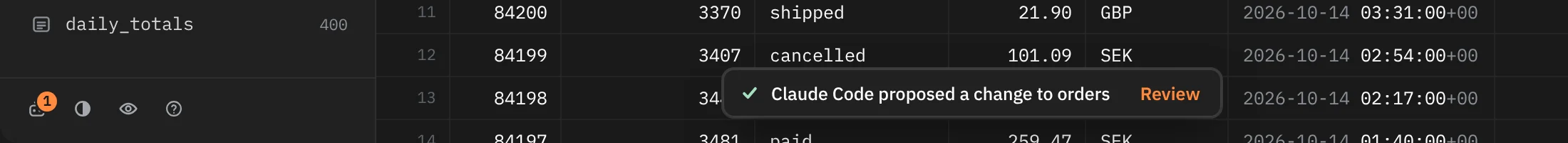 The foot of the window: the Agents button with an orange 1, and a toast reading Claude Code proposed a change to orders, with Review.